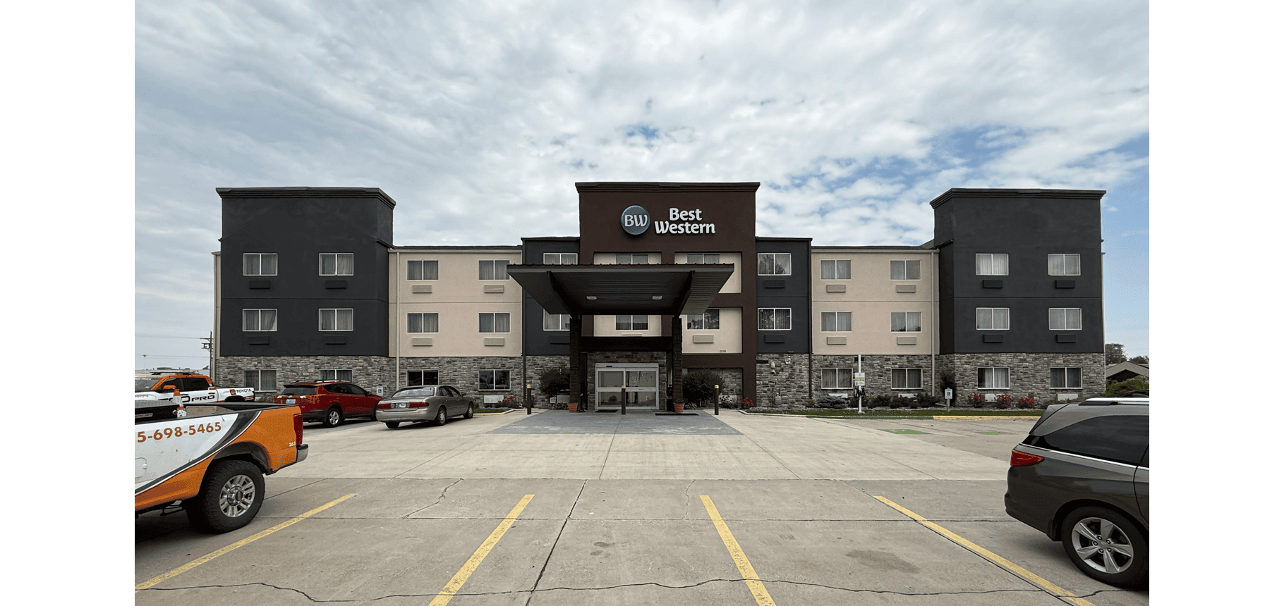 Front facade of a three-story hotel building